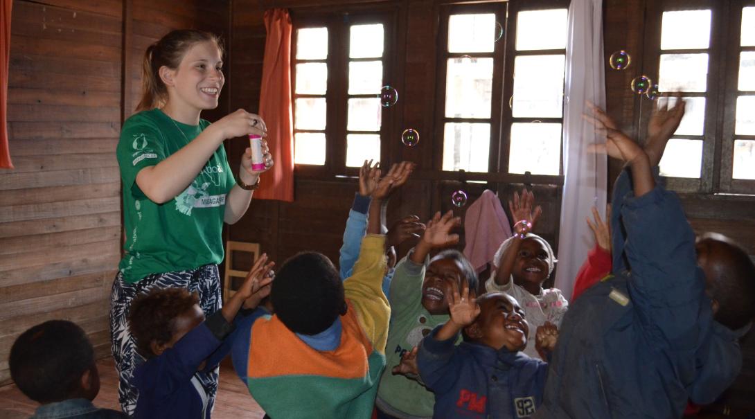 Fundraising is one way of financing your trip to Madagascar. A volunteer is having fun with children in Madagascar after she fundraised her trip to this African country.